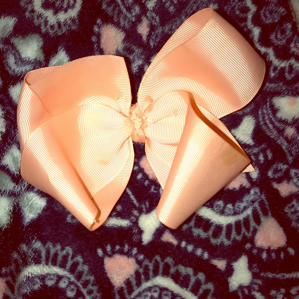 Coral pink bow for a little girl